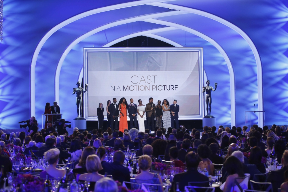 The cast of Black Panther celebrate on stage after the film won Outstanding Performance by a Cast in a Motion Picture. REUTERS/Mike Blake