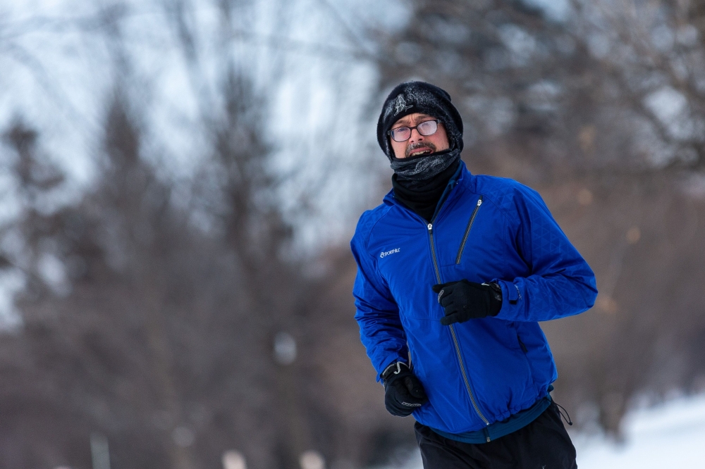 A runner passes through heavy frost in Nokomis Lake, south west Minneapolis, as temperatures in the area dipped below freezing overnight in Minnesota on January 29, 2019. AFP / Kerem Yucel