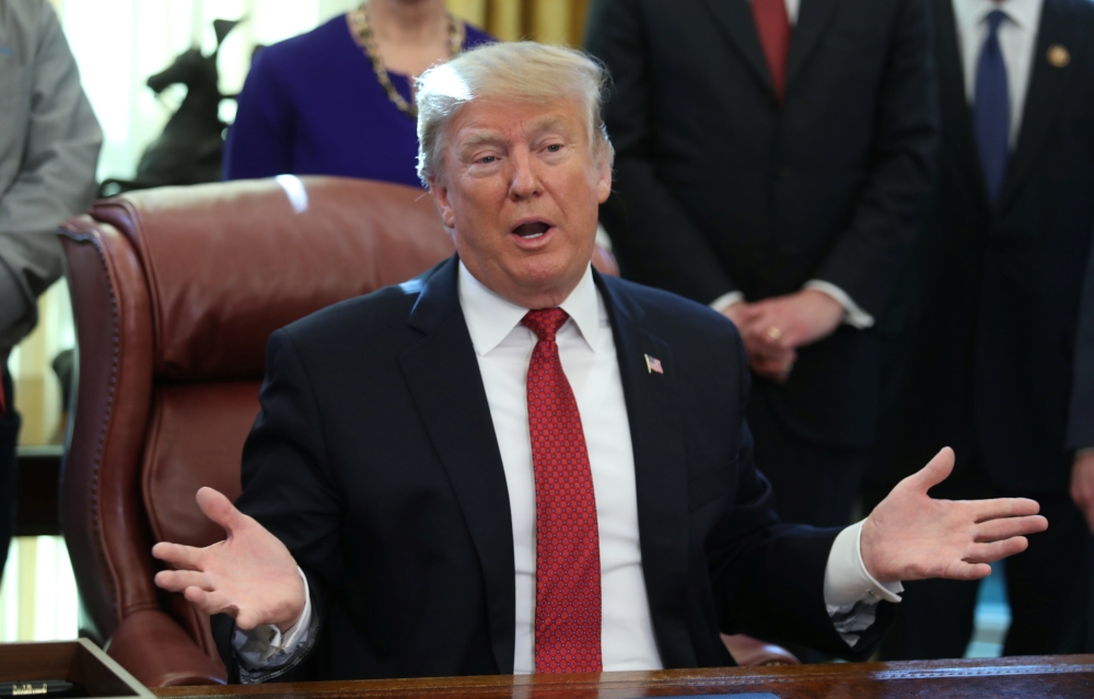 US President Donald Trump speaks speaks to reporters at a meeting with manufacturers and manufacturing workers in the Oval Office of the White House in Washington, US, January 31, 2019. (REUTERS/Jonathan Ernst)