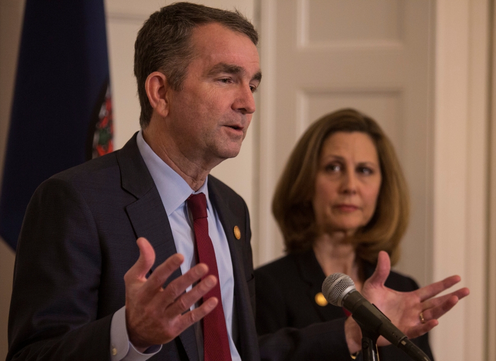 Virginia Governor Ralph Northam, accompanied by his wife Pamela Northam announces he will not resign during a news conference Richmond, Virginia, U.S. February 2, 2019. REUTERS/ Jay Paul