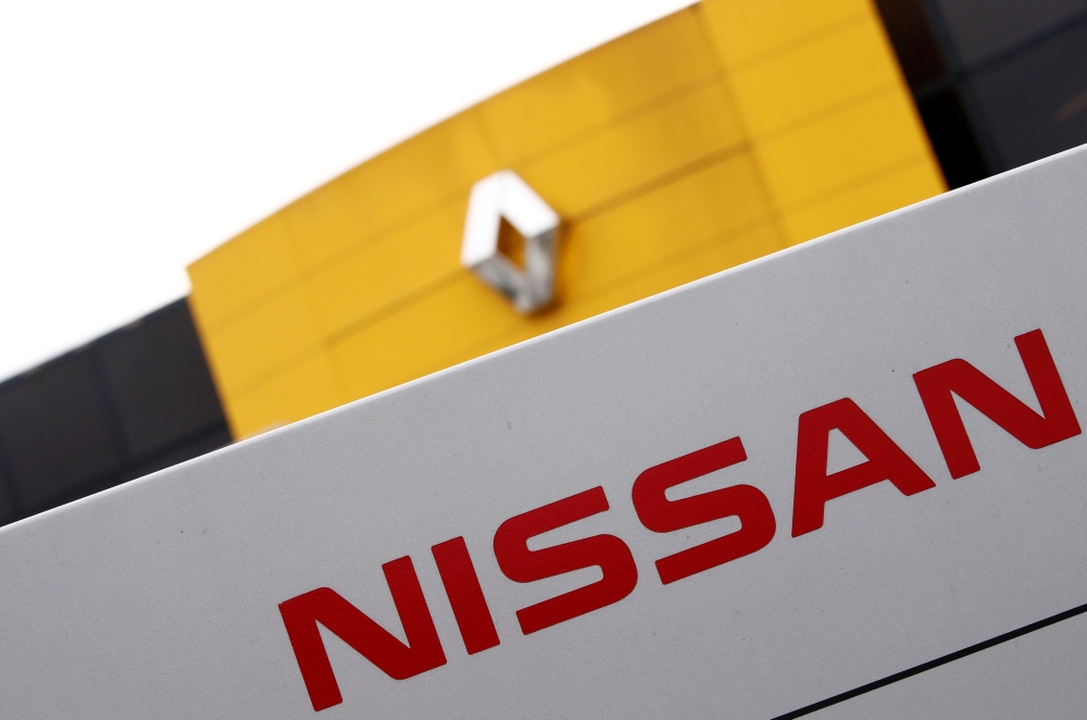 File photo of the logos of car manufacturers Renault and Nissan in front of a common dealership of the companies in Saint-Avold, France, January 15, 2019. REUTERS/Christian Hartmann/File Photo