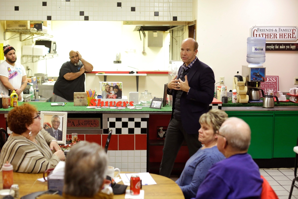 Former US Representative and 2020 Democratic presidential candidate John Delaney speaks with patrons during a campaign stop at TC Mae's restaurant on January 31, 2019 in Fort Dodge, Iowa. AFP / Joshua Lott