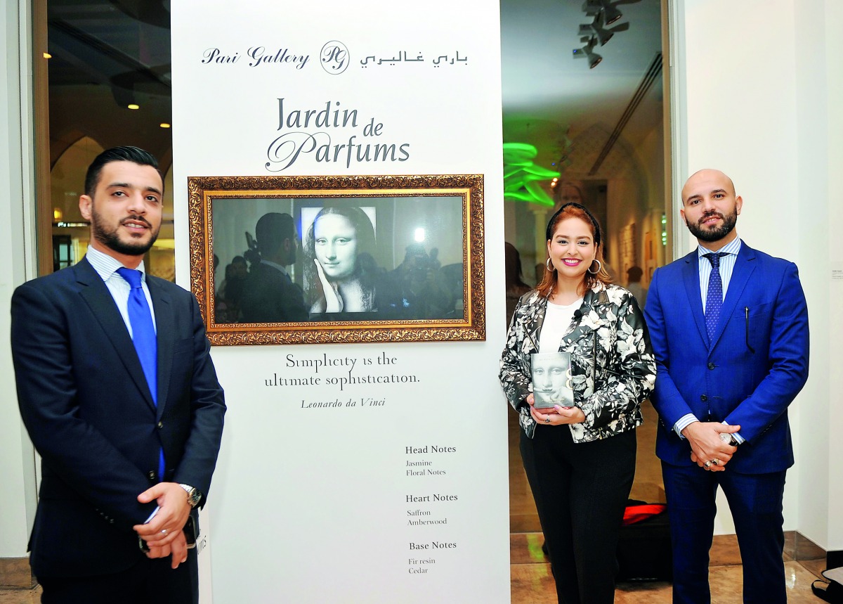 Noor Amer (centre), Export Manager, Jardin de Parfums; Abdessamad Ferg (right), Area Manager, and Maamoun Naser, Beauty Brand Manager at the launch of Mona Lisa Smile perfume by Pari Gallery at Anima Lounge, The Pearl yesterday.  Pic: Abdul Basit / The Pe