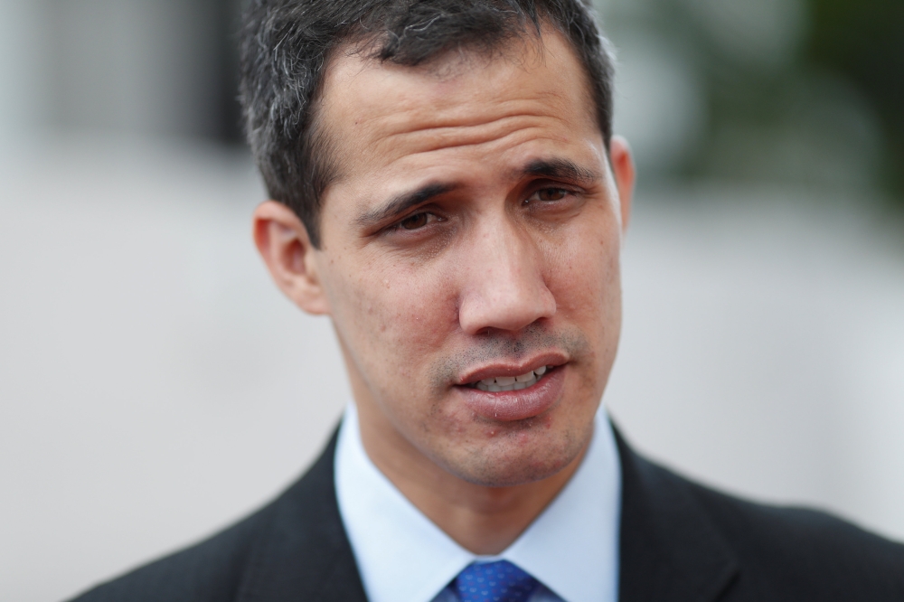 Venezuelan opposition leader and self-proclaimed interim president Juan Guaido pauses as he speaks during an interview with Reuters in Caracas, Venezuela January 31, 2019. REUTERS/Carlos Garcia Rawlins
