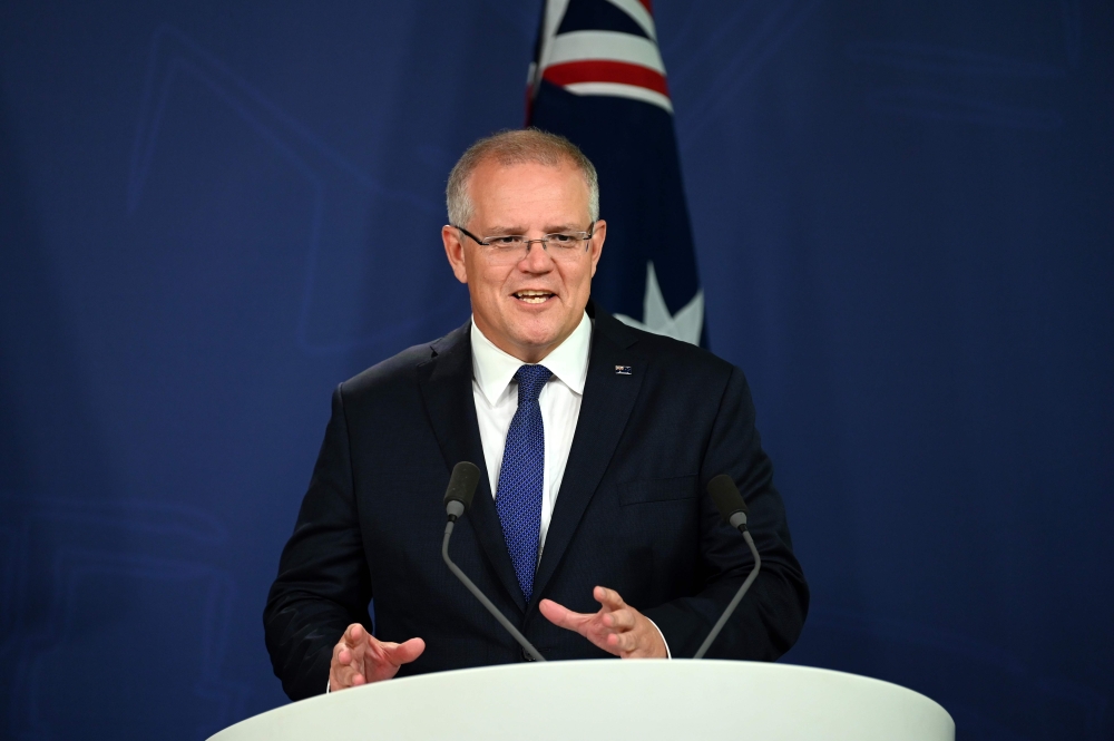 Australia's Prime Minister Scott Morrison briefs media about the flooding situation in Queensland during a press conference in Sydney on February 8, 2019. AFP / Saeed KHAN
