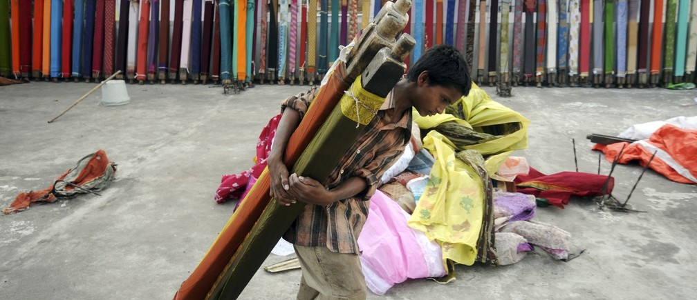 Born into poverty, thousands of children from the northern Indian state of Bihar have for years been trafficked to tourist-magnet Jaipur to work as slaves making bangles, embroidering or sewing buttons. Reuters file photo /Krishnendu Halder