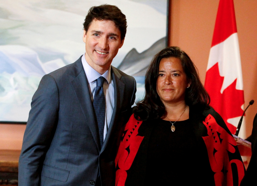 Jody Wilson-Raybould poses for a photo with Justin Trudeau during cabinet shuffle, in Ottawa, Ontario, Canada, January 14, 2019. Reuters/Patrick Doyle