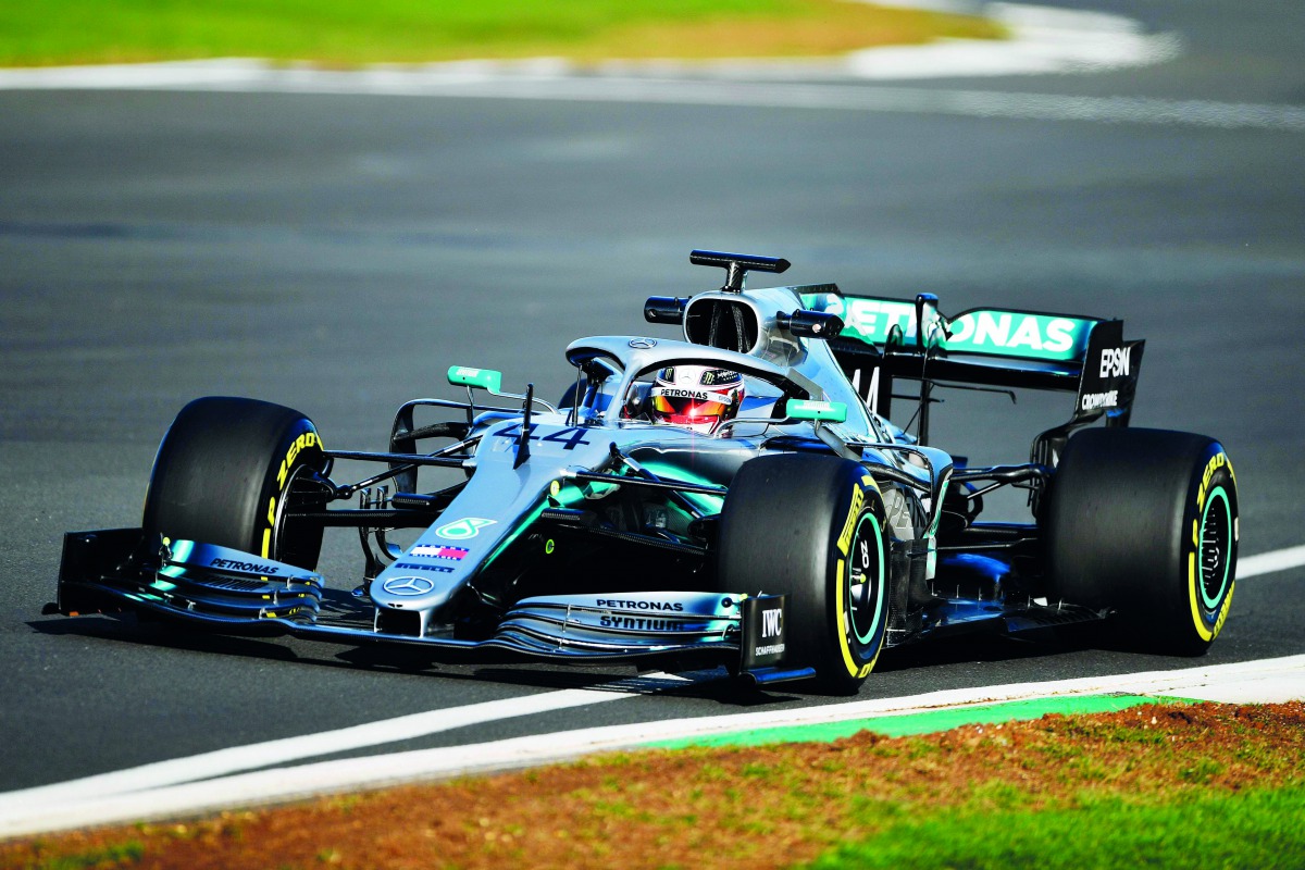 A handout picture taken at Silverstone in central England on February 13, 2019, and released by Mercedes in London, shows Mercedes' British driver Lewis Hamilton in the new Mercedes-AMG F1 W10 EQ Power+ formula one car.