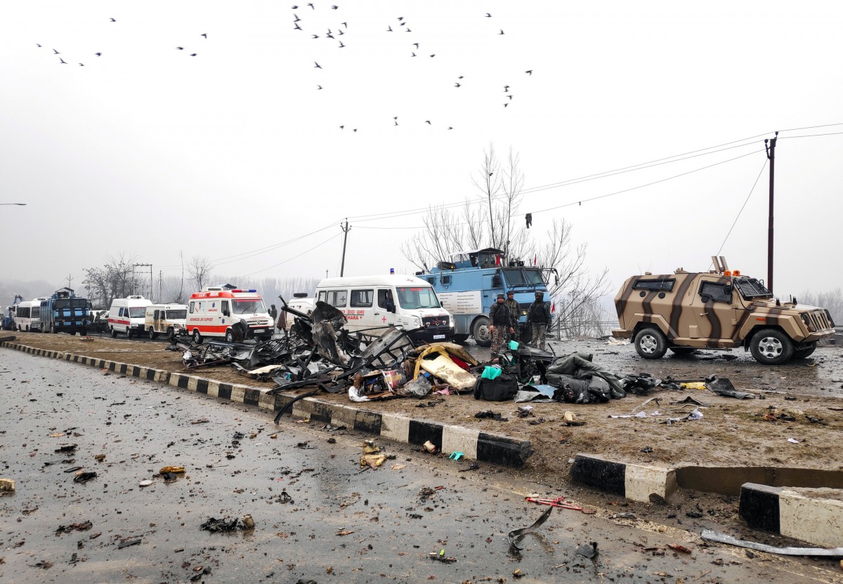 Indian soldiers examine the debris after an explosion in Lethpora in south Kashmir's Pulwama district February 14, 2019. Reuters/Younis Khaliq