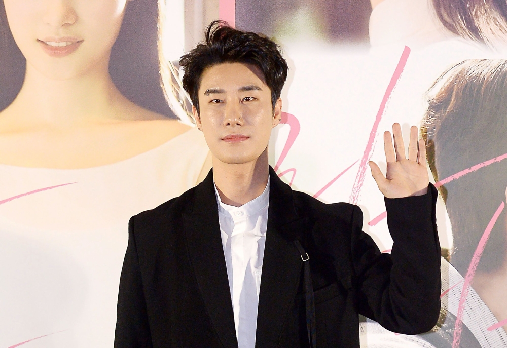 This picture taken on February 8, 2018 shows South Korean rapper San E during a press conference for his movie 