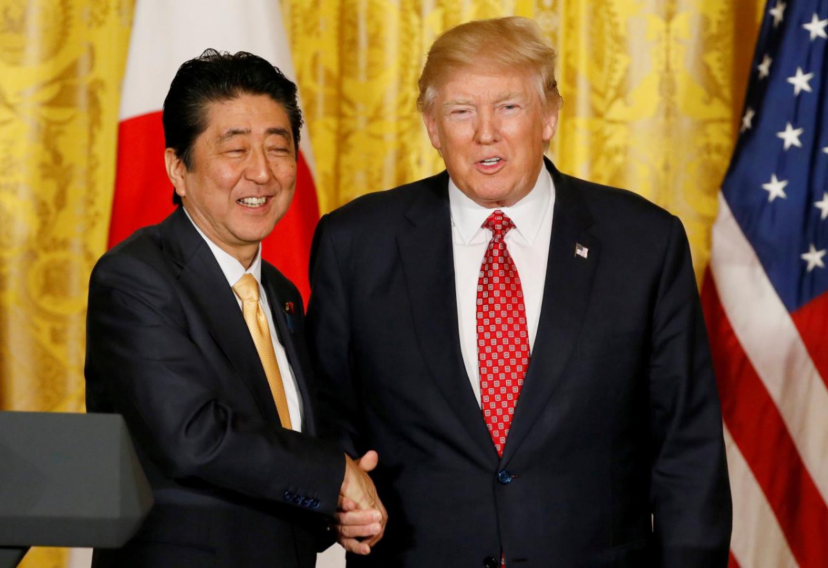 FILE PHOTO of Japanese Prime Minister Shinzo Abe (L) and US President Donald Trump. Reuters