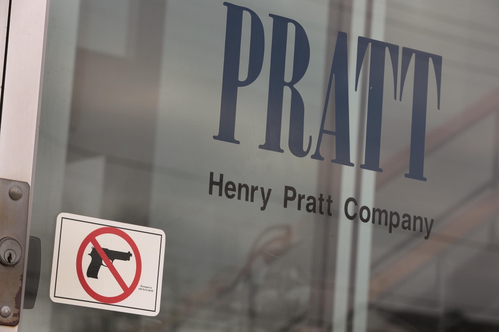 A sign on the front door of the Henry Pratt Company office shows that guns are not allowed in the building on February 16, 2019 in Aurora, Illinois. Scott Olson/Getty Images/AFP