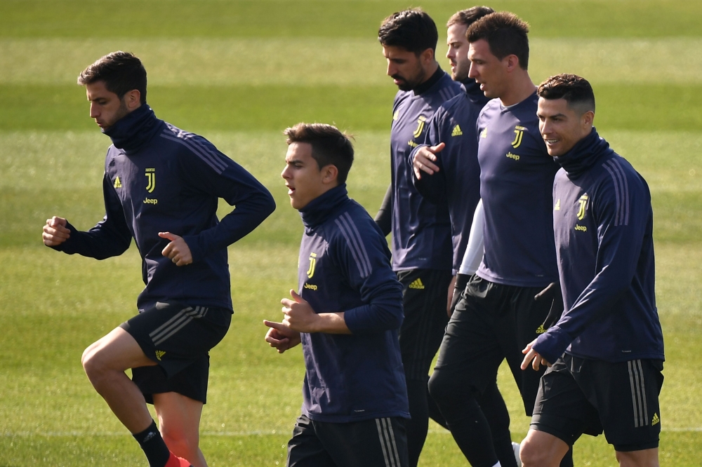 :(From L) Juventus' Uruguayan midfielder Rodrigo Bentancur, Juventus' Argentine forward Paulo Dybala, Juventus' German midfielder Sami Khedira, Juventus' Bosnian midfielder Miralem Pjanic, Juventus' Croatian forward Mario Mandzukic and Juventus' Portugues