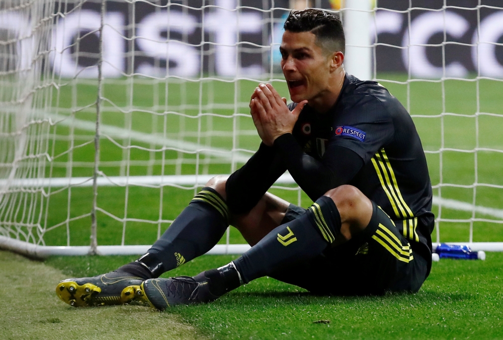 Juventus' Cristiano Ronaldo looks dejected. Reuters/Juan Medina
