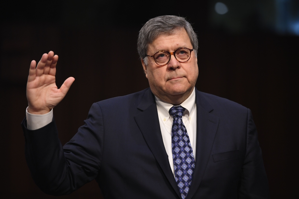 (FILES) In this file photo taken on January 15, 2019 William Barr, nominee to be US Attorney General, takes the oath before testifying during a Senate Judiciary Committee confirmation hearing on Capitol Hill in Washington, DC. AFP / SAUL LOEB
