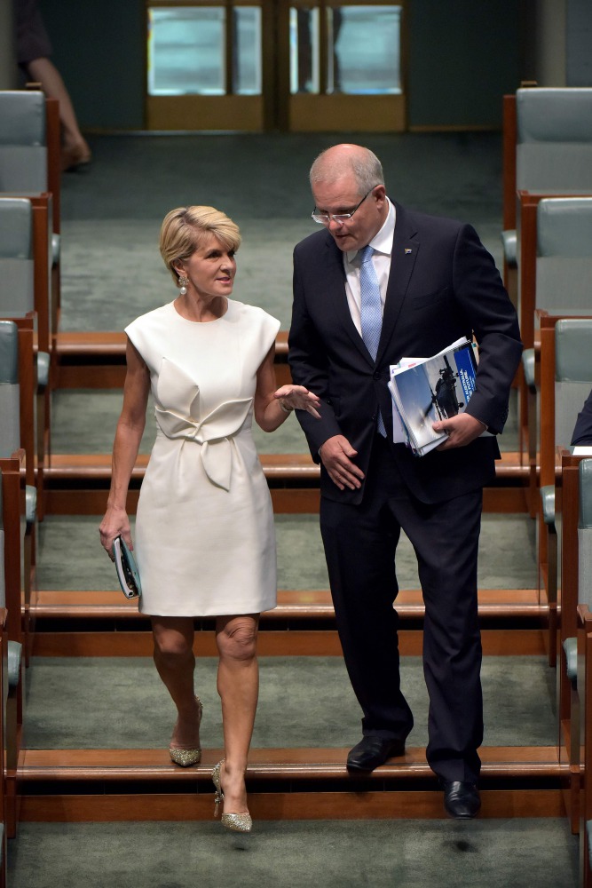 Former Australian foreign minister Julie Bishop (L) walks down the stairs with Prime Minister Scott Morrison at the Parliament House in Canberra on February 21, 2019.  AFP / Mark Graham