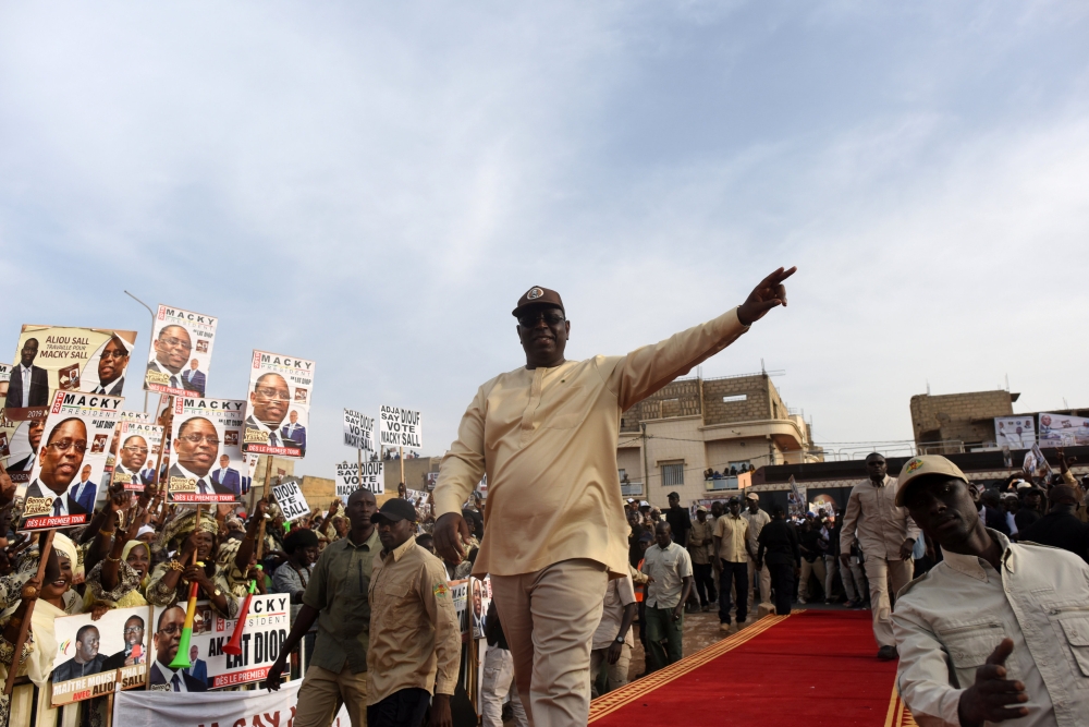 Senegal's President and candidate for the upcoming presidential elections Macky Sall greets his supporters during his campaign rally In Guediawaye, Senegal February 20, 2019. Reuters/Sylvain Cherkaoui