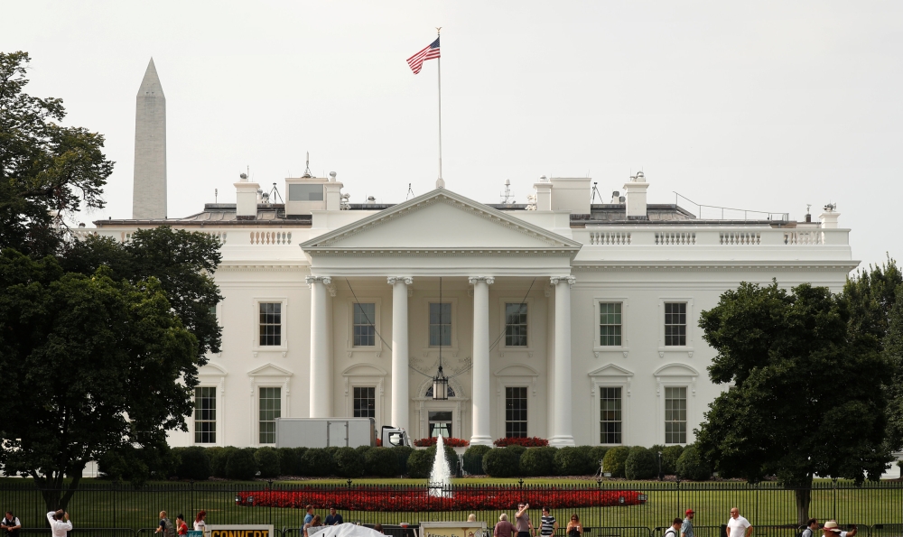 The US flag flies at full staff less than 48 hours after the death of John McCain over the White House, August 27, 2018. Reuters Kevin Lamarque