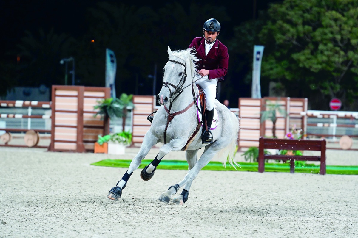 Qatari show jumper Awad Alqahtani astride Cassander Van Het Bremhof during the Big Tour competition on the second day of the Amir’s Golden Sword Championships at the Outdoor Arena of the Qatar Equestrian
Federation, yesterday.