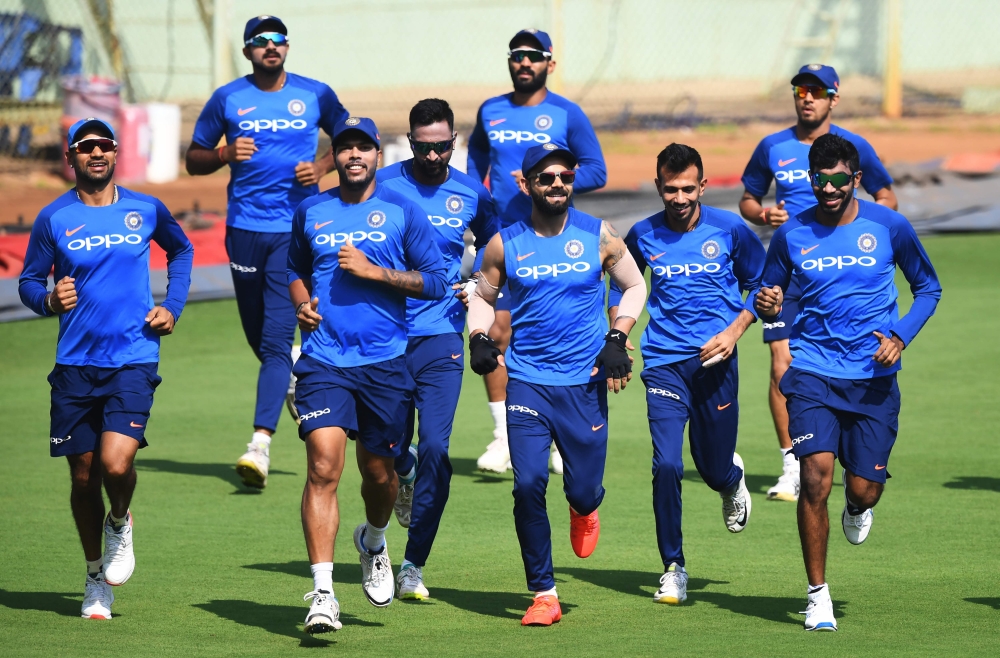 Indian cricket team's captain Virat Kohli (C) with teammates attend a training session at the Dr. Y.S. Rajasekhara Reddy ACA–VDCA Cricket Stadium in Visakhapatnam on February 23, 2019. (AFP / Dibyangshu SARKAR)