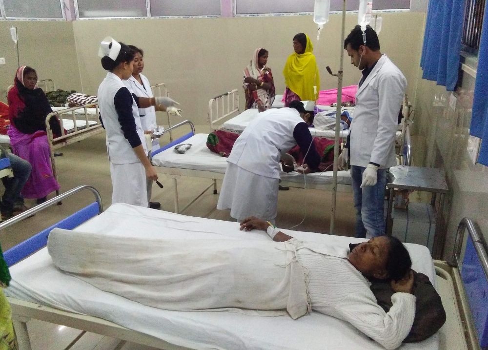 Indian victims are under medical treatment at Jorhat hospital after allegedly drinking toxic bootleg liquor in Assam's Golaghat district on February 22, 2019. AFP / Biju BORO