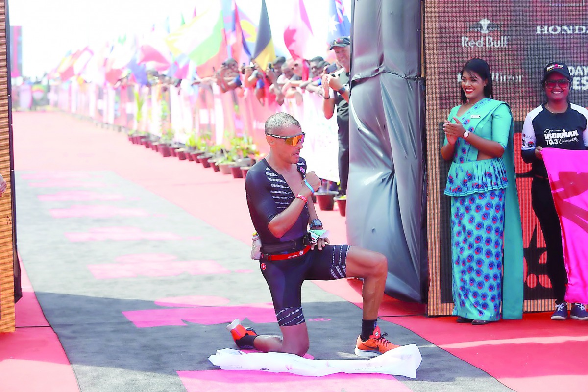 Luxembourg’s Olivier Godart celebrates after winning the Ironman 70.3 Colombo triathlon in the Sri Lankan capital yesterday.