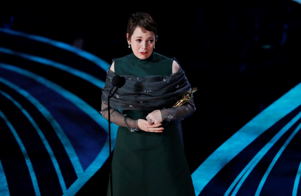 Olivia Colman accepts the Best Actress award for her role in 