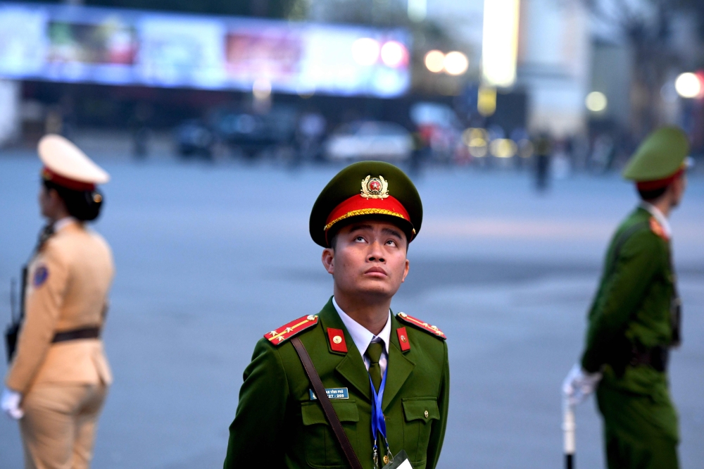 Vietnamese policemen guard the area near the Sofitel Legend Metropole hotel in Hanoi on February 27, 2019, ahead of the second US-North Korea summit. AFP / Ye Aung Thu 