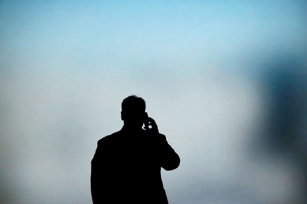 A man talks on his phone at the Mobile World Congress (MWC) in Barcelona on February 27, 2019.  AFP / Pau Barrena 