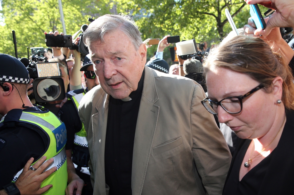Cardinal George Pell (C) makes his way to the court in Melbourne on February 27, 2019. AFP / Con Chronis  