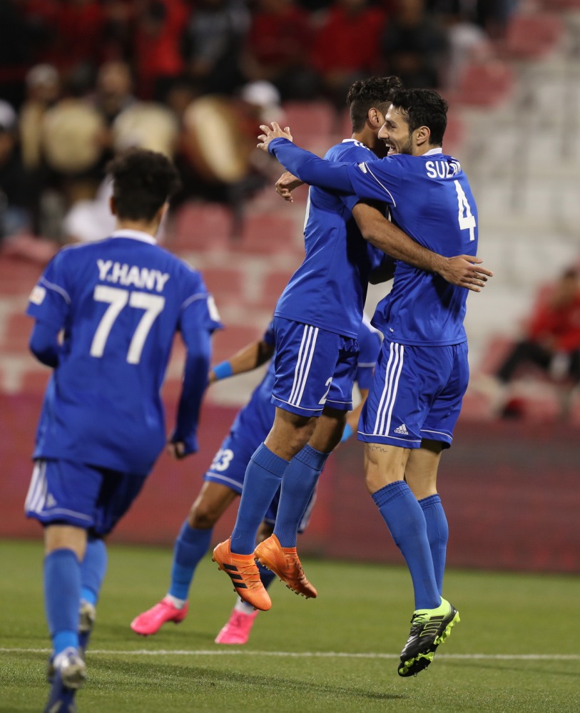 Al Shahania’s Rebin Ghareeb Solaka (right) celebrates with a team-mate after scoring against Al Rayyan during their QNB Stars League match played at the Al Arabi Stadium, yesterday.
