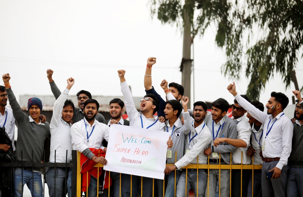 People shout slogans before the arrival of Indian Air Force pilot, who was captured by Pakistan on Wednesday, near Wagah border, on the outskirts of the northern city of Amritsar, India, March 1, 2019. REUTERS/Danish Siddiqui
