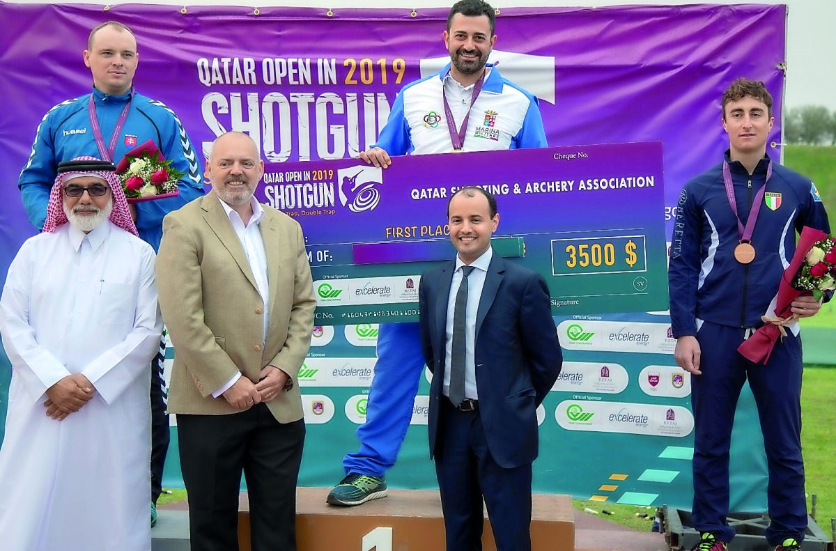 Italy’s Alessandro Chianese (top, right) celebrates on the podium with the silver medallist Hubert Andrzej Oleinik (Slovakia) and compatriot Andrea Vescovi and officials during the presentation ceremony, yesterday.