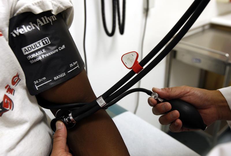 A doctor checks the blood pressure of a patient at the J.W.C.H. safety-net clinic in the center of skid row in downtown Los Angeles July 30, 2007. Reuters/Lucy Nicholson
