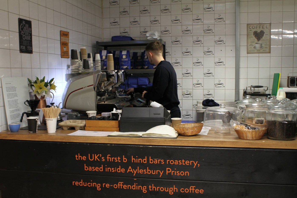 A 20-year-old prisoner makes coffee inside Aylesbury prison, UK, where speciality coffee company Redemption Roasters is training him with industry-level skills. Thomson Reuters Foundation/Lin Taylor