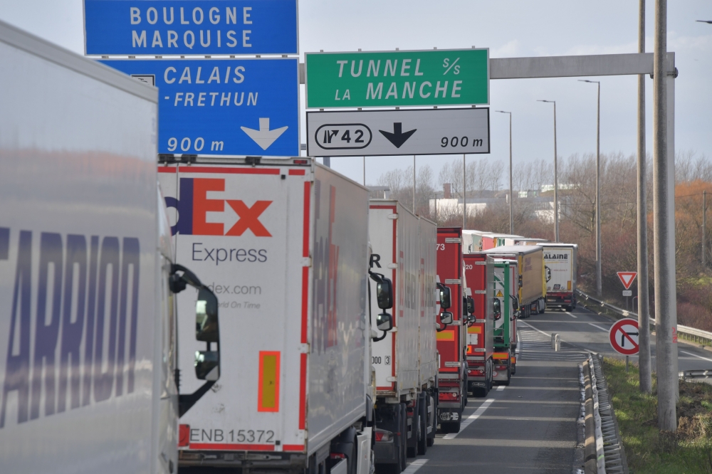 Trucks  heading to the Channel tunnel stuck in a traffic jam on the A16 highway between Dunkerque and Calais due to extensive controls by the customs officers protesting against the lack of staff and material ahead of the Brexit on March 4, 2019 . AFP / P