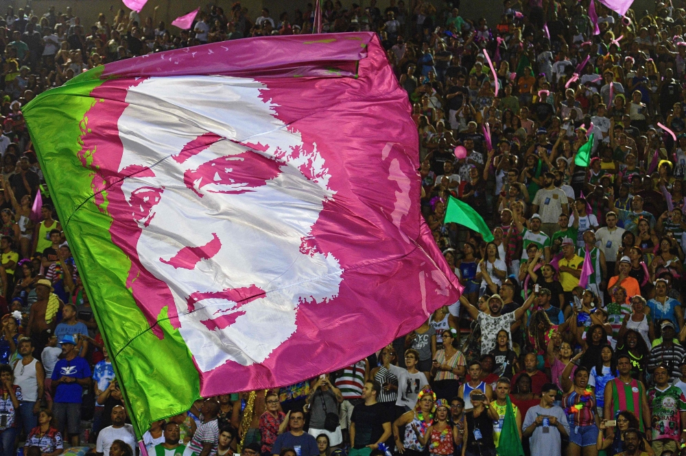 A flag depicting the image of murdered council woman Marielle Franco is seen during the second night of Rio's Carnival parade at the Sambadrome in Rio de Janeiro, on March 5, 2019. AFP / Carl De Souza 
