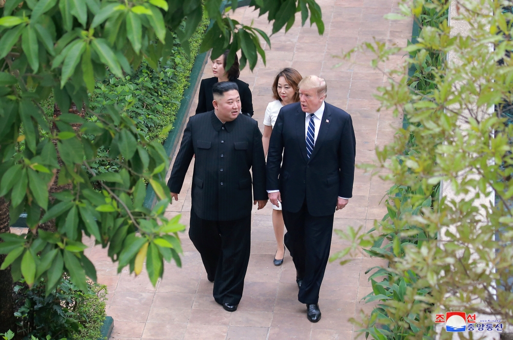 North Korea's leader Kim Jong Un walks with U.S. President Donald Trump during the second North Korea-U.S. summit in Hanoi, Vietnam, in this photo released on March 1, 2019 by North Korea's Korean Central News Agency (KCNA). KCNA via REUTERS 