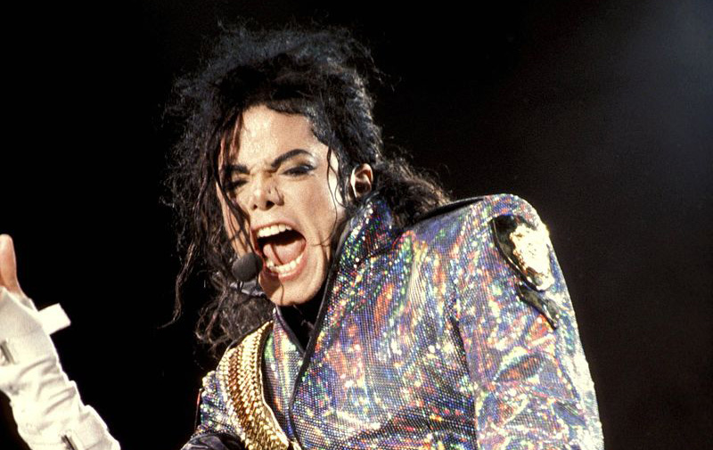 The artist Michael Jackson performing his song 