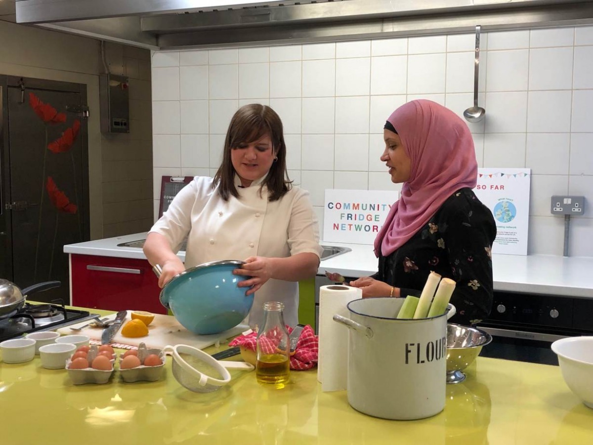 (Left to right) Chef Natalie Coleman and Manaza Nasa, volunteer at the Food Academy Community Fridge in the East Ham Leisure Centre, prepare a Spanish tortilla with products from the community fridge in London, United Kingdom, on March 6, 2019. Thomson Re