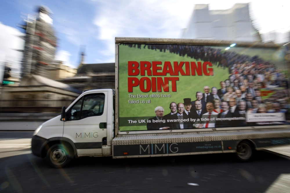 A van with a billboard entitled Breaking Point and aimed at holding the 'Brext Elite' to account, is pictured during its unveiling by For our Future's Sake (FFS) - the youth and student wing of the People's Vote campaign - near the Houses of Parliament in