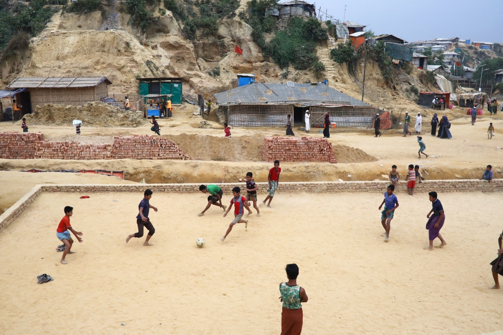 Rohingya refugee children play football at the Balukhali refugee camp in Cox's Bazar, Bangladesh, March 5, 2019. REUTERS/Mohammad Ponir Hossain