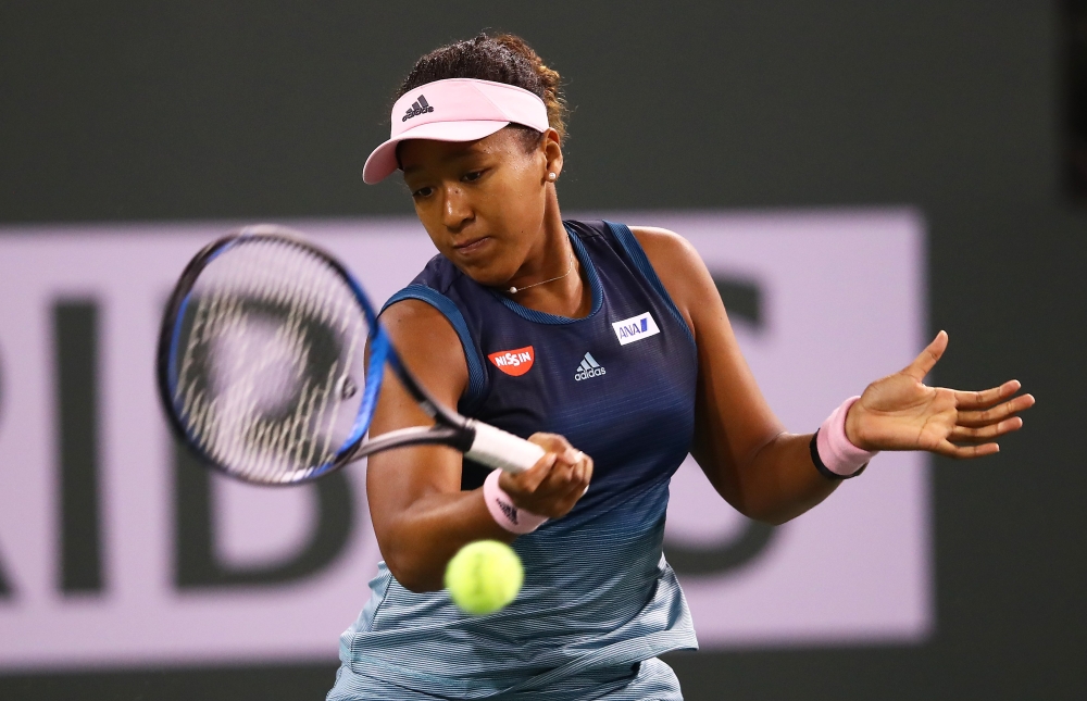 Naomi Osaka of Japan plays a forehand against Kristina Mladenovic of France during their women's singles second round match on day six of the BNP Paribas Open at the Indian Wells Tennis Garden on March 09, 2019 in Indian Wells, California. Clive Brunskill