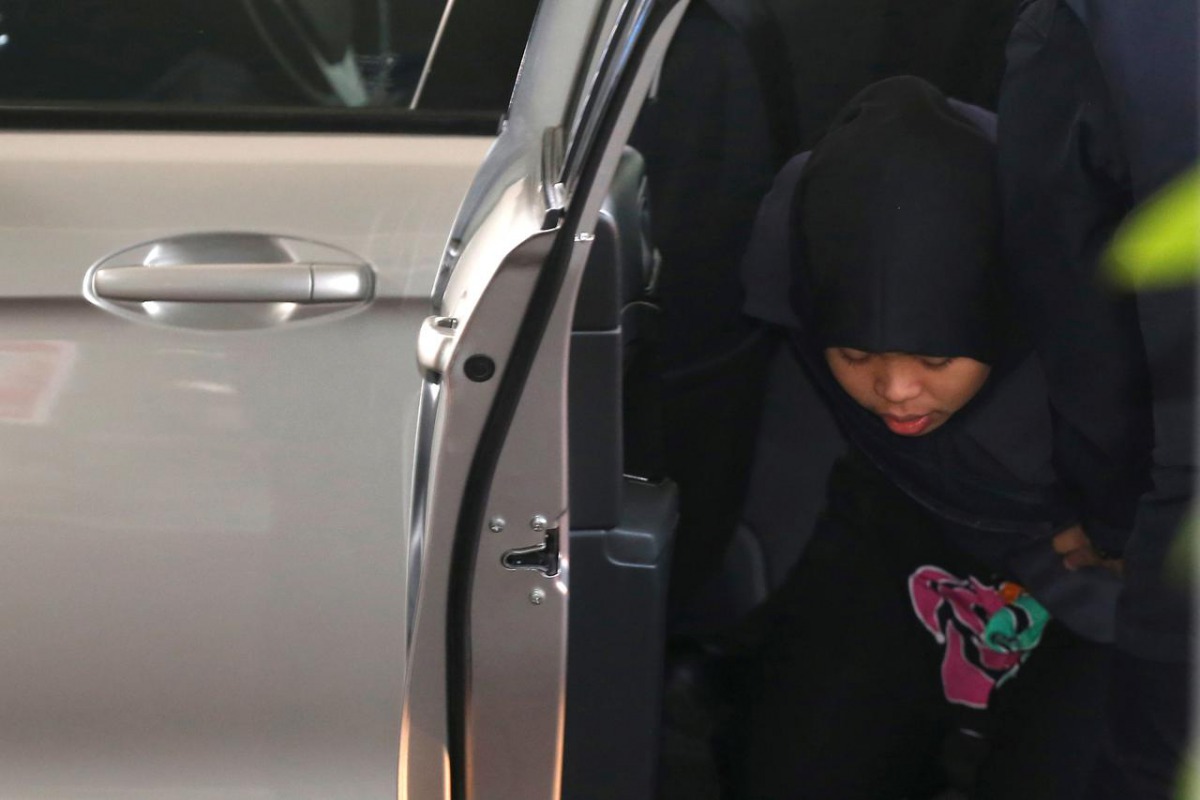 Indonesian Siti Aisyah, who is on trial for the killing of Kim Jong Nam, the estranged half-brother of North Korea's leader, arrives at the Shah Alam High Court on the outskirts of Kuala Lumpur, Malaysia March 11, 2019. REUTERS/Lai Seng Sin