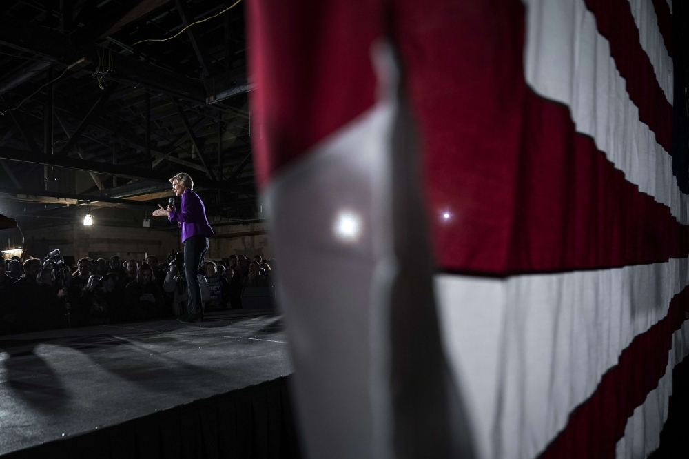 Sen. Elizabeth Warren (D-MA), one of several Democrats running for the party's nomination in the 2020 presidential race, speaks during a campaign event, March 8, 2019 in the Queens borough of New York City.  Drew Angerer/AFP
