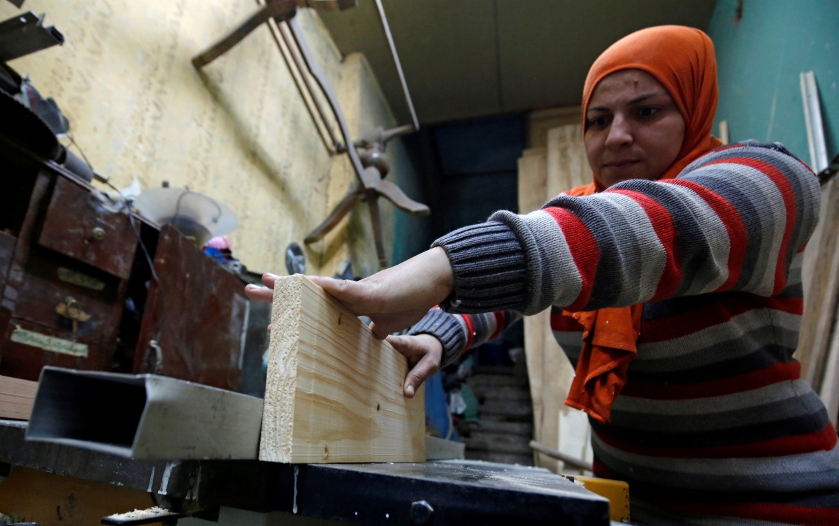 File photo: 30 years old Asmaa Megahed, a carpenter and designer, works inside her workshop in Cairo, February 27, 2017. Reuters/Amr Abdallah Dalsh