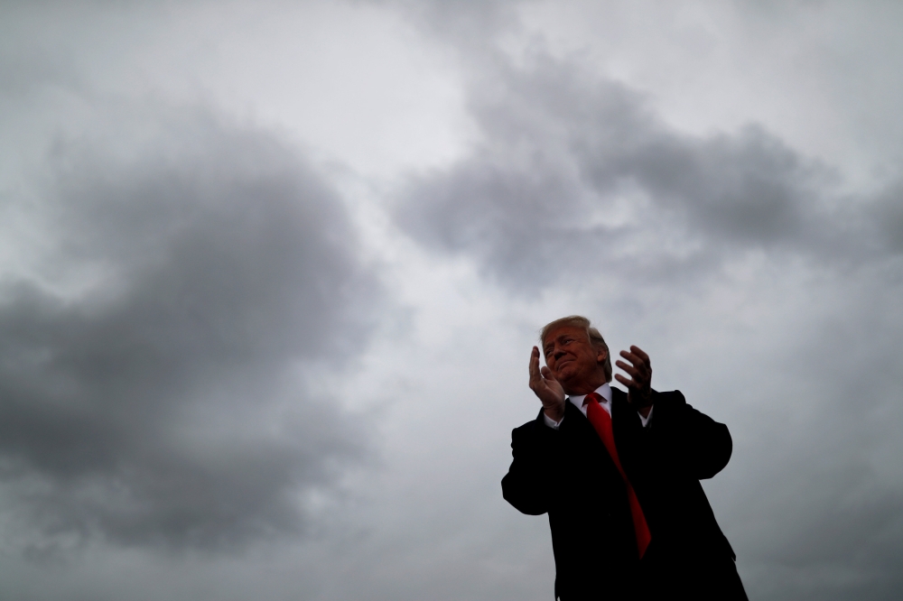 FILE PHOTO: U.S. President Donald Trump holds a campaign rally at Huntington Tri-State Airport in Huntington, West Virginia, U.S., November 2, 2018. REUTERS/Carlos Barria/File Photo