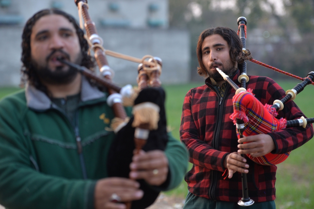 A Pakistani musical band perform with bagpipes made at the Mid East bagpipe factory in the eastern city of Sialkot on January 25, 2019. AFP / Aamir Qureshi 