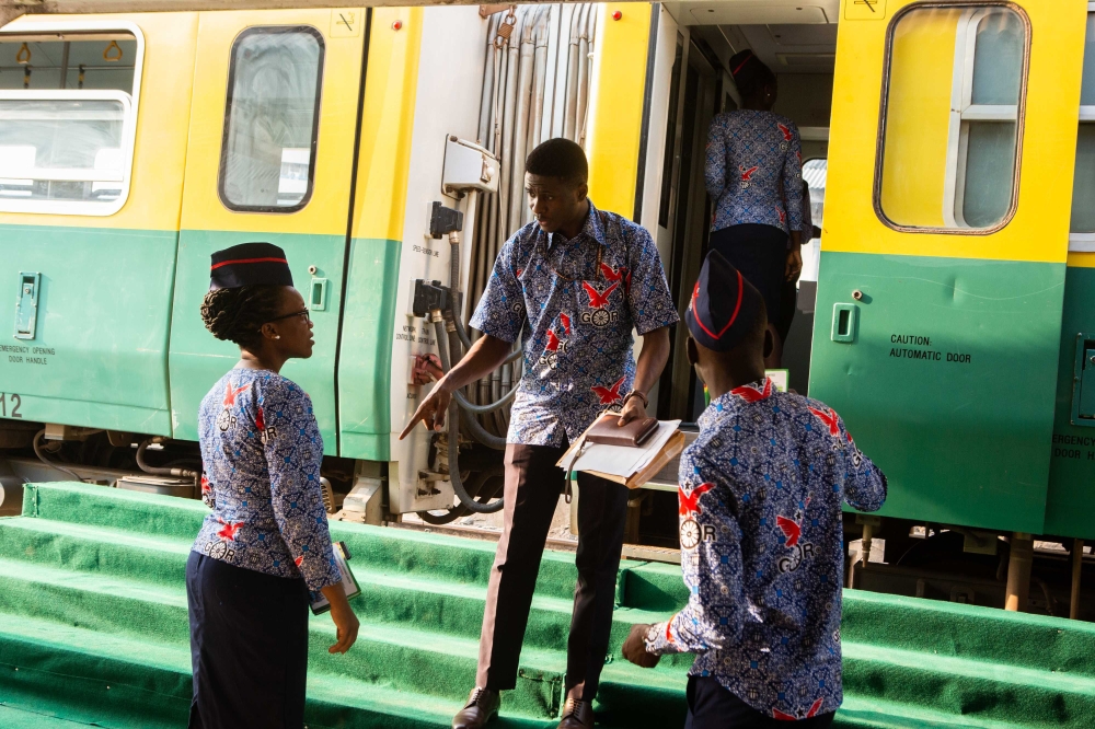 Staff members of Ghana's railway system ready to board passengers on the train reconnecting Accra to Tema, 25 kilometres east of the capital city on January 29, 2019. AFP / Ruth Mcdowall 
 