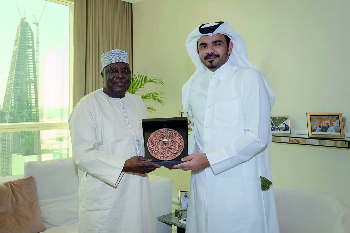 The President of Qatar Olympic Committee, H E Sheikh Joaan bin Hamad Al Thani presenting a memento to the President of the Confederation of African Athletics, Colonel Kalkaba Malboum, during a meeting held in Doha, yesterday.